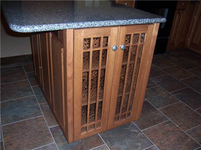 Glass doors on the end of a peninsula cabinet